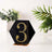 Black hexagon table number 3 with rhinestones on a clear base.