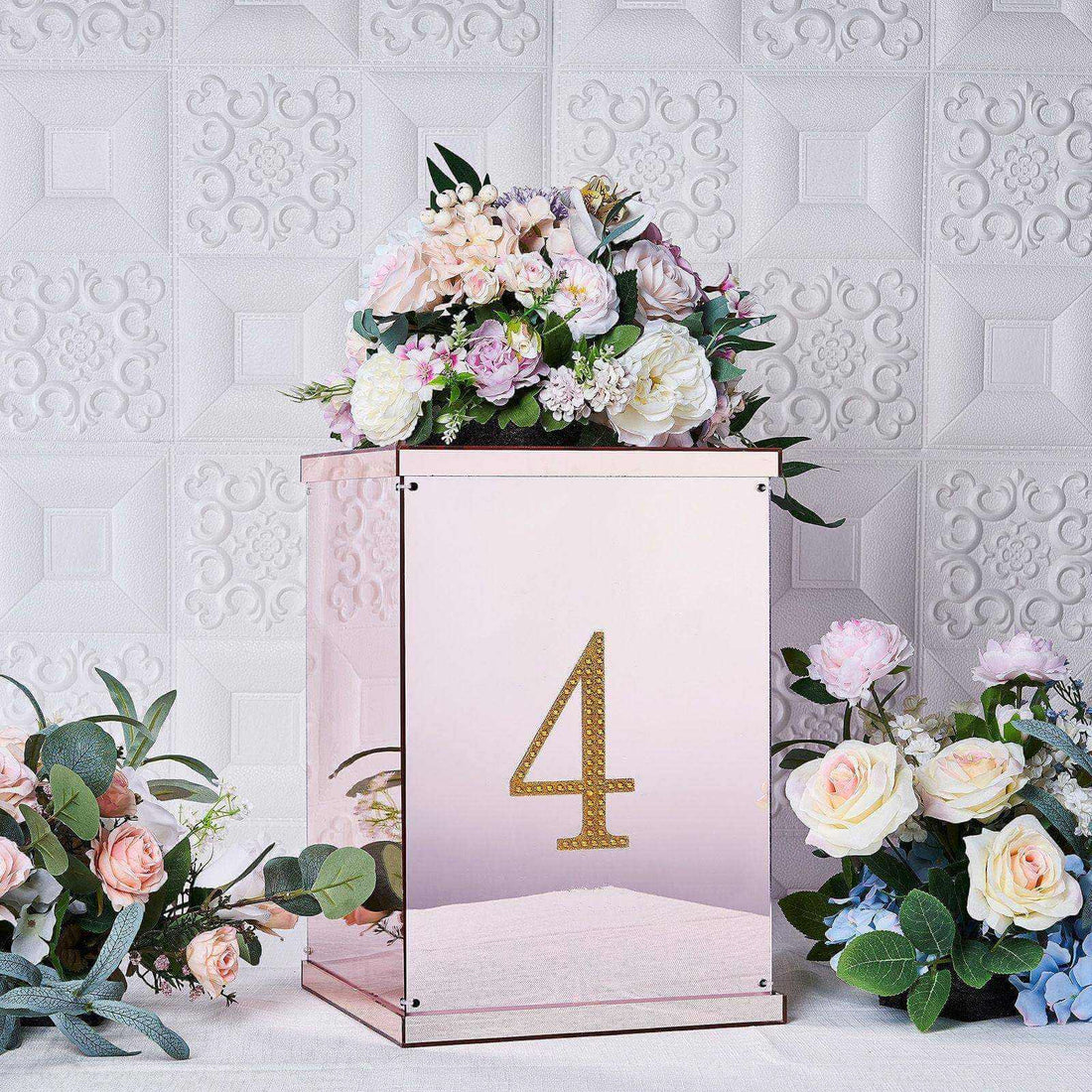 Elegant floral arrangement in a mirrored box with the number 4.