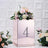 Decorative mirrored box with floral arrangement and number four display.