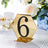 Gold hexagon table number sign with black rhinestones, number 6.
