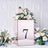Rose gold flower box with number 7, adorned with mixed floral arrangements.
