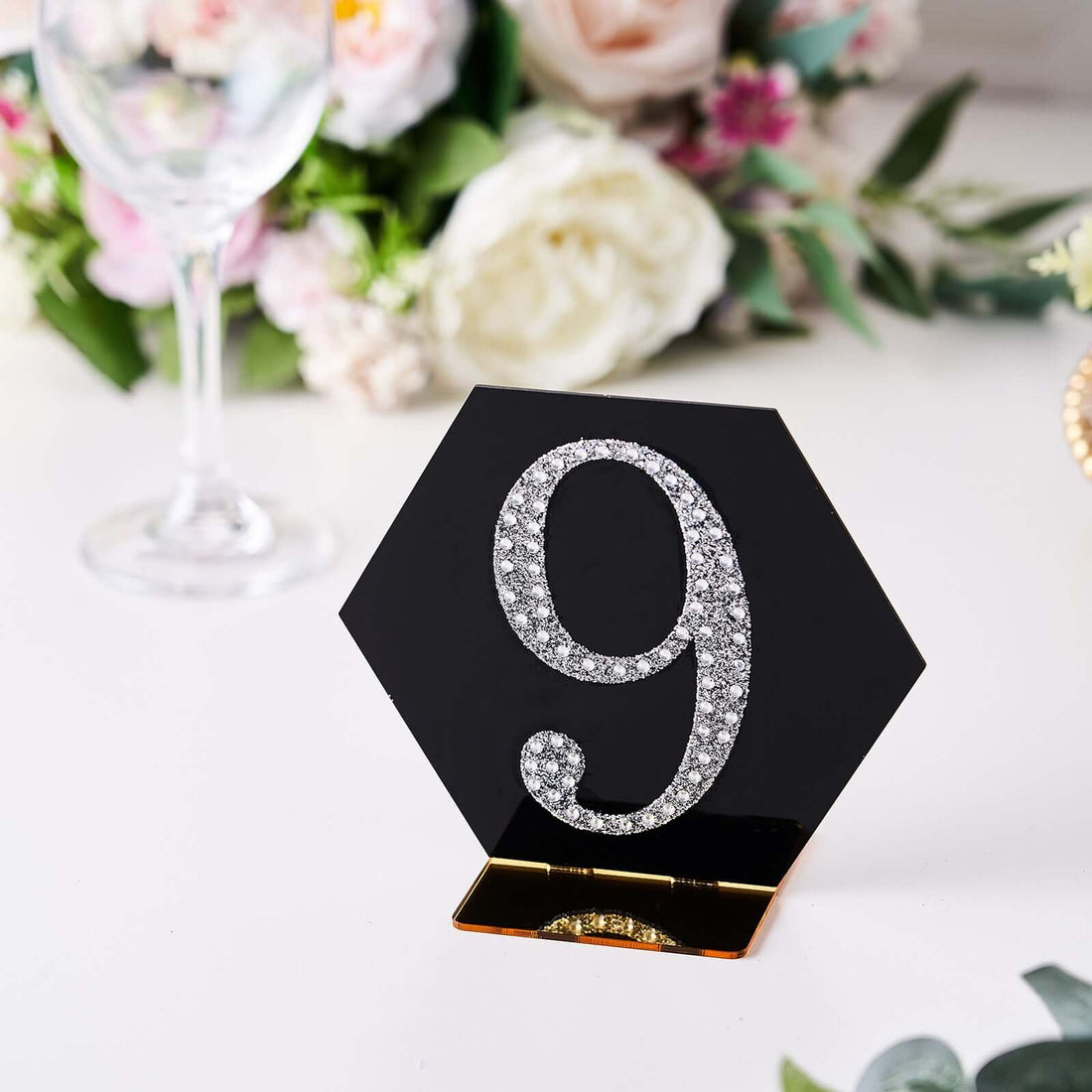 Elegant black table number 9 with rhinestones for events or weddings.