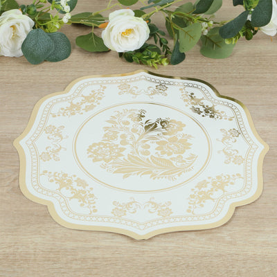 Elegant floral gold-patterned serving tray on wooden surface.