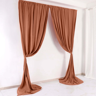 Brown fabric curtains draped elegantly in a studio setting.