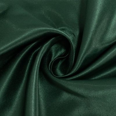 Close-up of smooth, dark green satin fabric texture. #whtbkgd