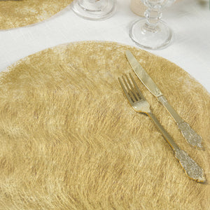 Gold round placemat with fork and knife on a white tablecloth.