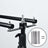 Black adjustable tripod with detachable rods and hardware
