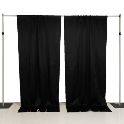 Black fabric curtains on a backdrop stand for versatile room styling