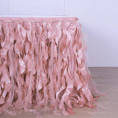 Pink satin table skirt with flowing ribbons for events and decorations