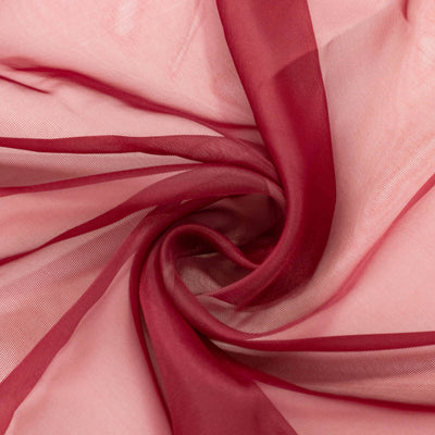 Red sheer fabric in a swirling texture pattern. #whtbkgd