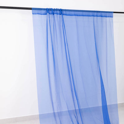 Blue sheer curtain fabric hanging on a rod
