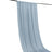 Light blue drapery fabric hanging gracefully