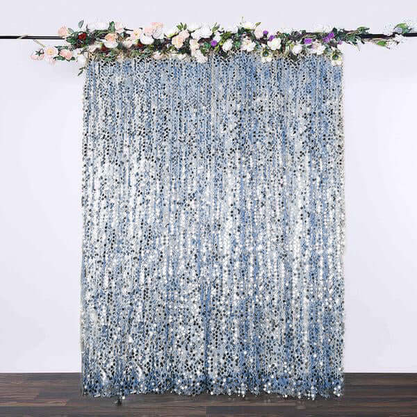 Blue sequin backdrop with floral decoration for events and photography.