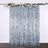 Blue sequin backdrop with floral decoration for events and photography.