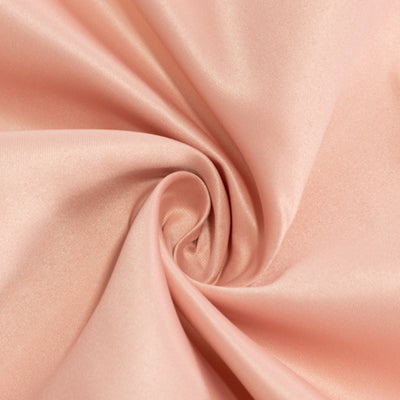Soft peach satin fabric with a smooth, glossy finish. #whtbkgd