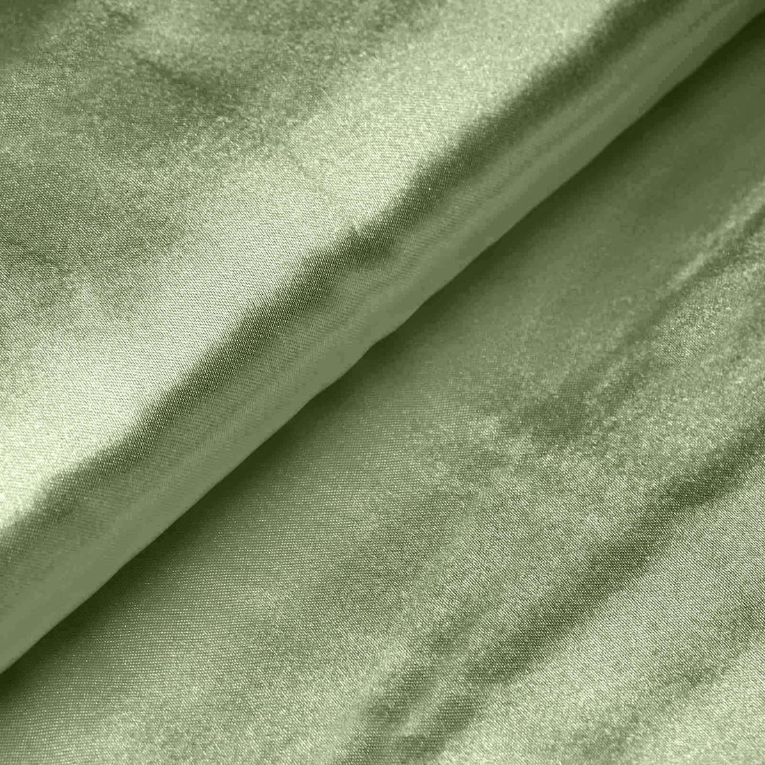 Textured green satin fabric close-up, showcasing elegant sheen and softness. #whtbkgd