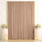 Elegant beige curtain backdrop with floral arrangements and candles