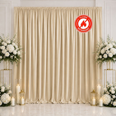 Elegant beige wedding backdrop with white floral arrangements and candles, flame retardant