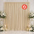 Elegant beige wedding backdrop with white floral arrangements and candles, flame retardant