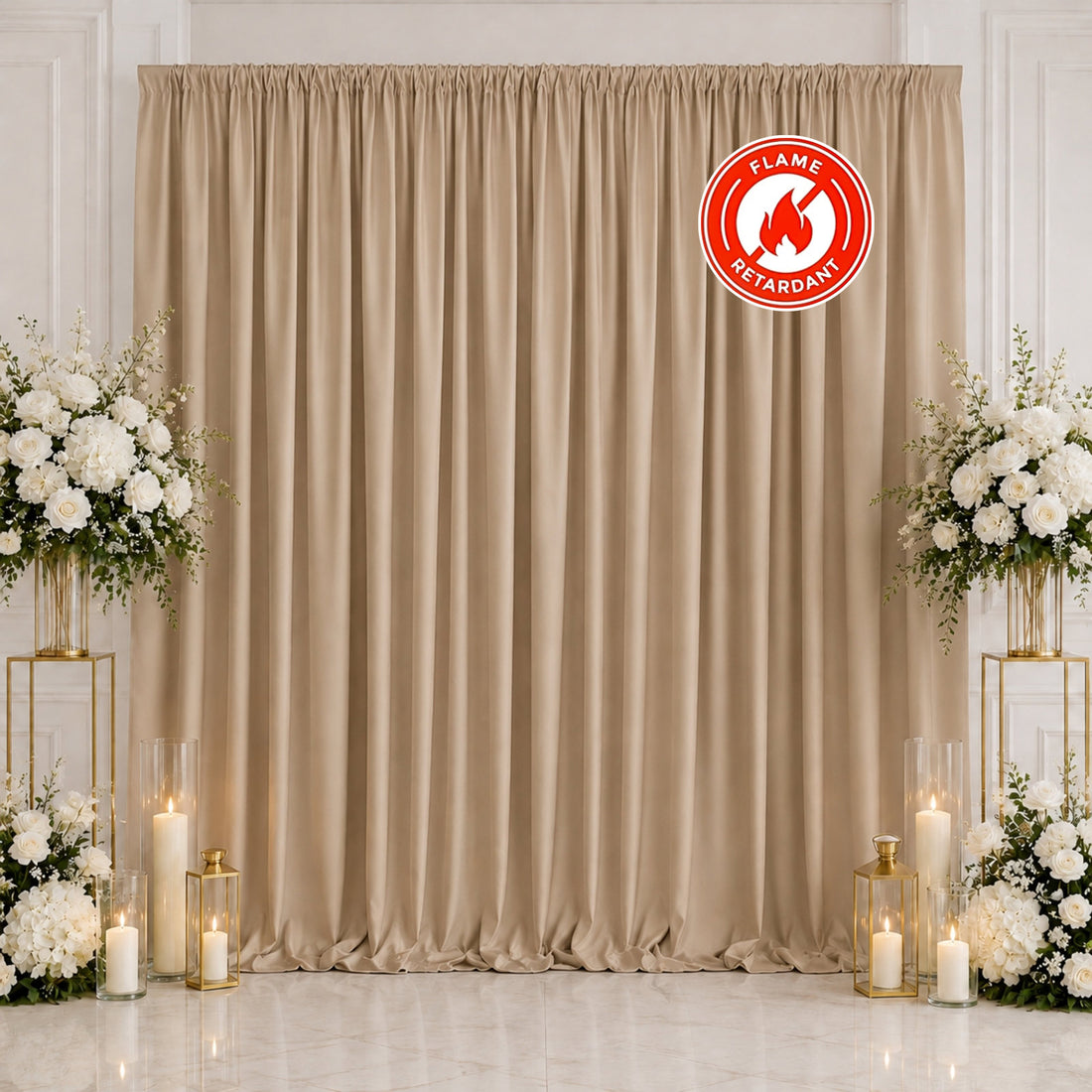Elegant beige wedding backdrop with white floral arrangements and candles