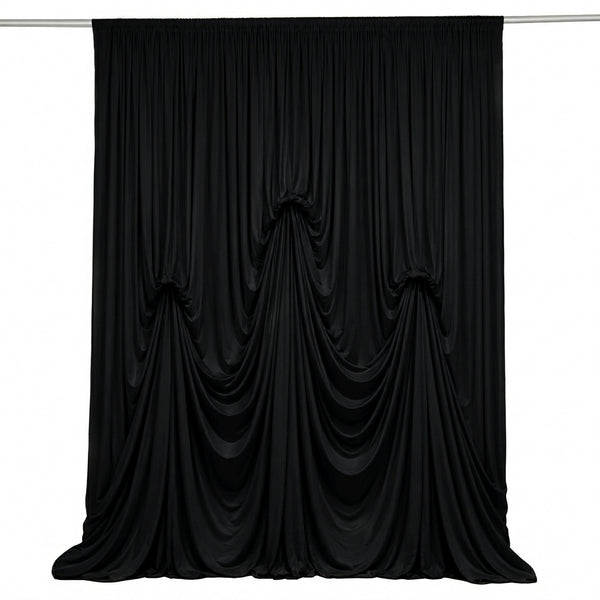 Elegant black draped curtain backdrop on a white background