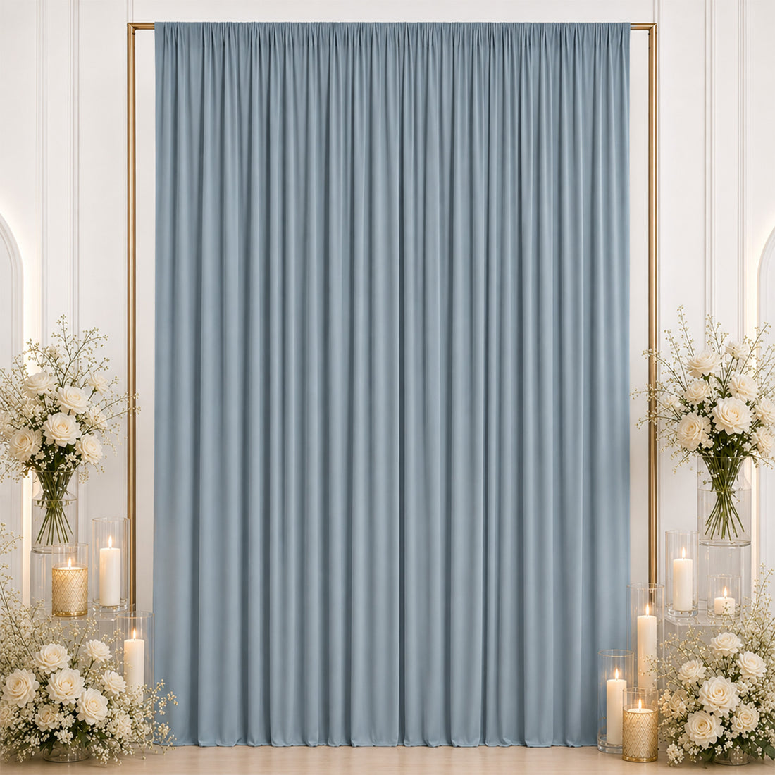 Elegant blue draped curtain with white floral candle centerpiece decor