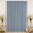 Elegant blue draped curtain with white floral candle centerpiece decor