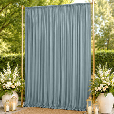 Elegant blue-gray wedding backdrop curtain with gold stand and floral arrangements