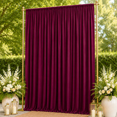 Elegant burgundy backdrop curtain with gold frame and floral decor outdoors