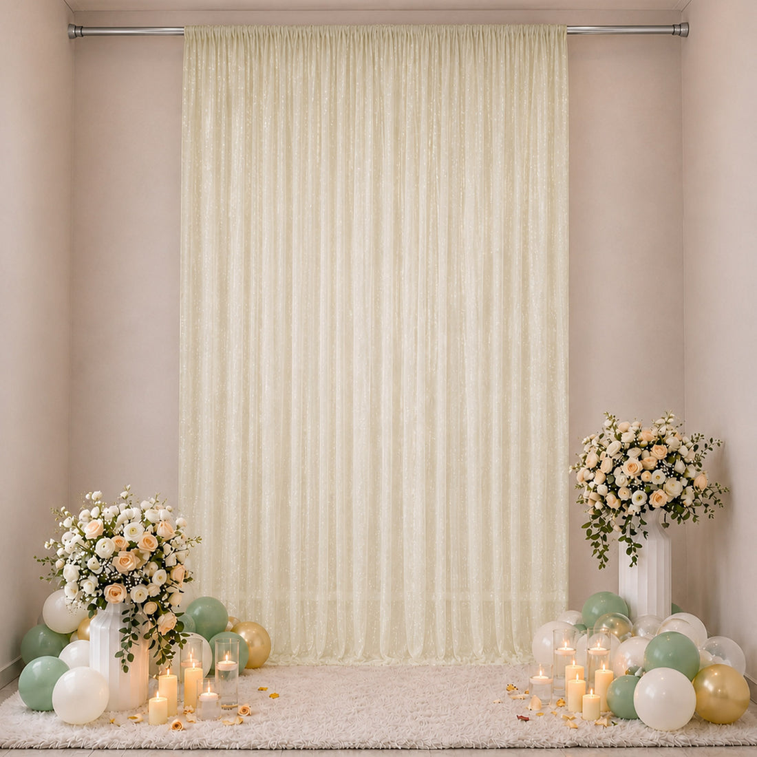 Elegant cream backdrop with floral arrangements, candles, and pastel balloons