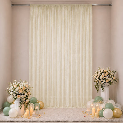 Elegant cream backdrop with floral arrangements, candles, and pastel balloons