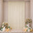 Elegant cream backdrop with floral arrangements, candles, and pastel balloons