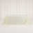 Elegant cream tablecloth draped over rectangular table in minimalist studio setting