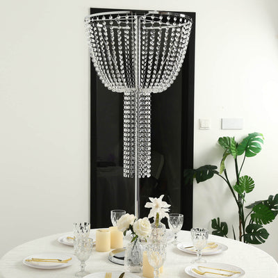 Elegant crystal chandelier centerpiece above a modern dining table