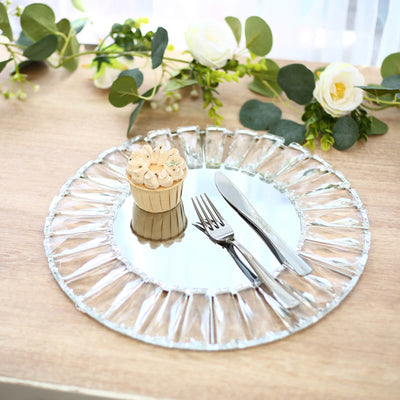 Elegant crystal glass dessert plate with mini cupcake and silver cutlery