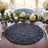 Elegant dining table with white roses, crystal glasses, and navy placemats