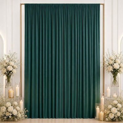 Elegant emerald green curtain backdrop with white roses and candles