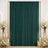 Elegant emerald green curtain backdrop with white roses and candles