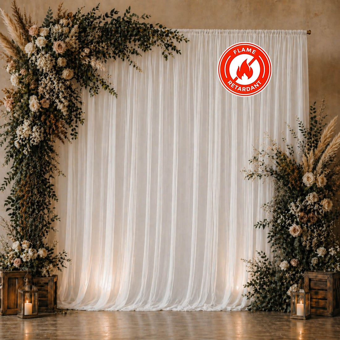Elegant floral wedding backdrop with white drapery and lanterns, flame-retardant sign