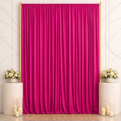 Elegant fuchsia satin curtain backdrop with floral arrangements and candles