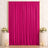 Elegant fuchsia satin curtain backdrop with floral arrangements and candles