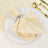 Elegant gold polka dot napkin with silver ring and gold cutlery table setting