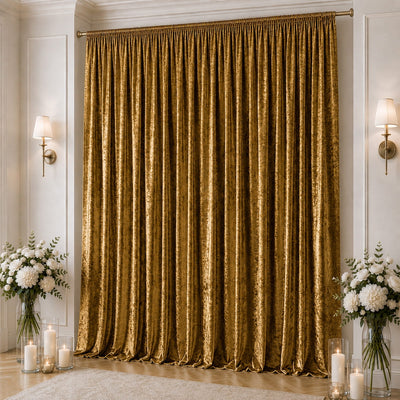 Elegant gold velvet curtains in a luxury living room with floral decor