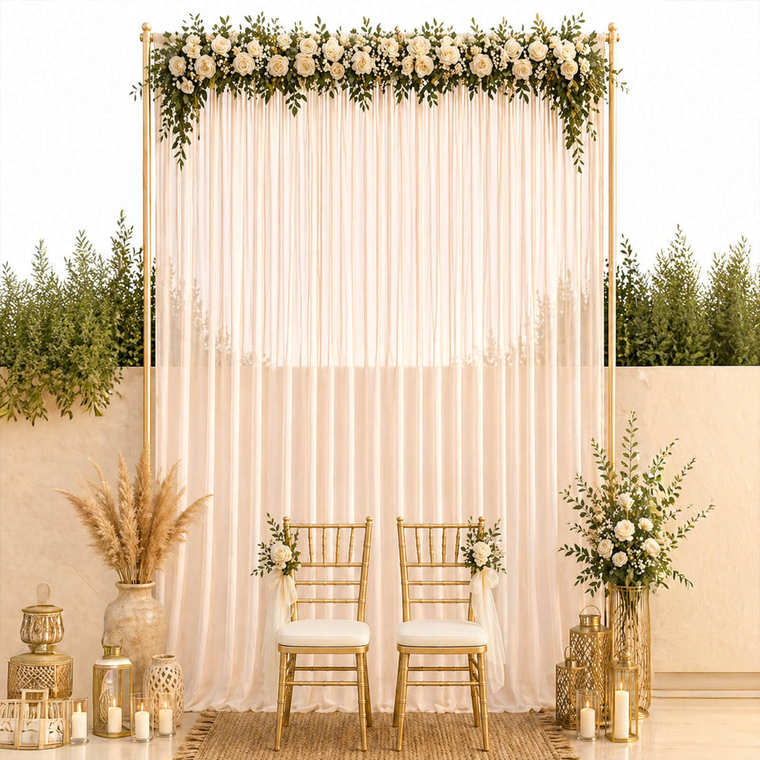 Elegant gold wedding backdrop with white roses, drapes, and chairs