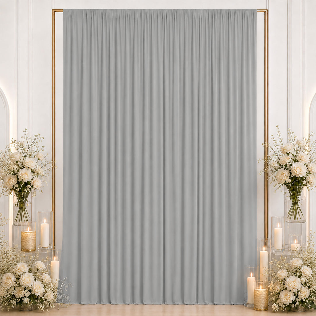 Elegant gray curtain backdrop with white roses, candles, and gold frame