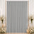 Elegant gray curtain backdrop with white roses, candles, and gold frame