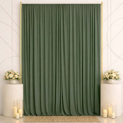Elegant green curtain backdrop with floral arrangements and candles<\/final>