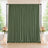 Elegant green draped wedding backdrop with floral arrangements and candles