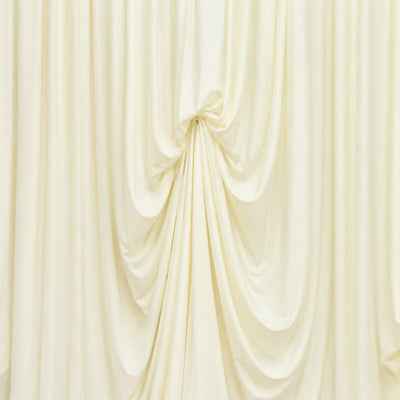 Elegant ivory draped fabric backdrop with soft pleats and folds