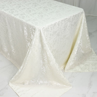 Elegant ivory jacquard tablecloth draped over a table